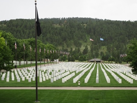 Headstones and flags at Black Hills National Cemetery.
