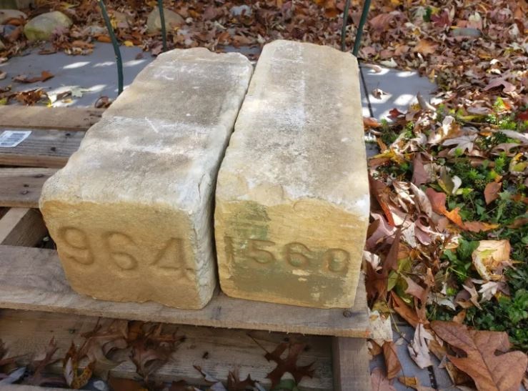 Two of the 6×6-inch stone markers from Annapolis National Cemetery evaluated by NCA historians and retained for the administration's artifact collection in 2022. After the Civil War, the Army installed the markers at the gravesites of thousands of unidentified Union soldiers and sailors. (NCA)