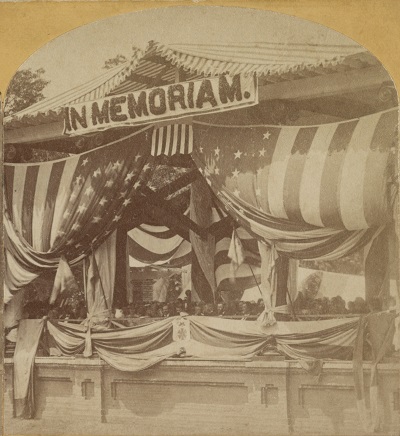 Detail of a stereograph showing President Ulysses S. Grant and General John Logan seated at the flag-draped Old Amphitheater, Arlington Cemetery, on Decoration Day, May 30, 1873.